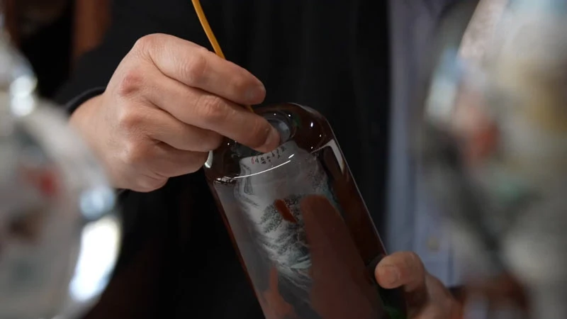 Three Generations Breathing Life into China's Bottled Masterpieces