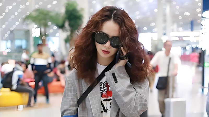 Qi Wei's Streetside Style: Grey Suit and Voluminous Curls