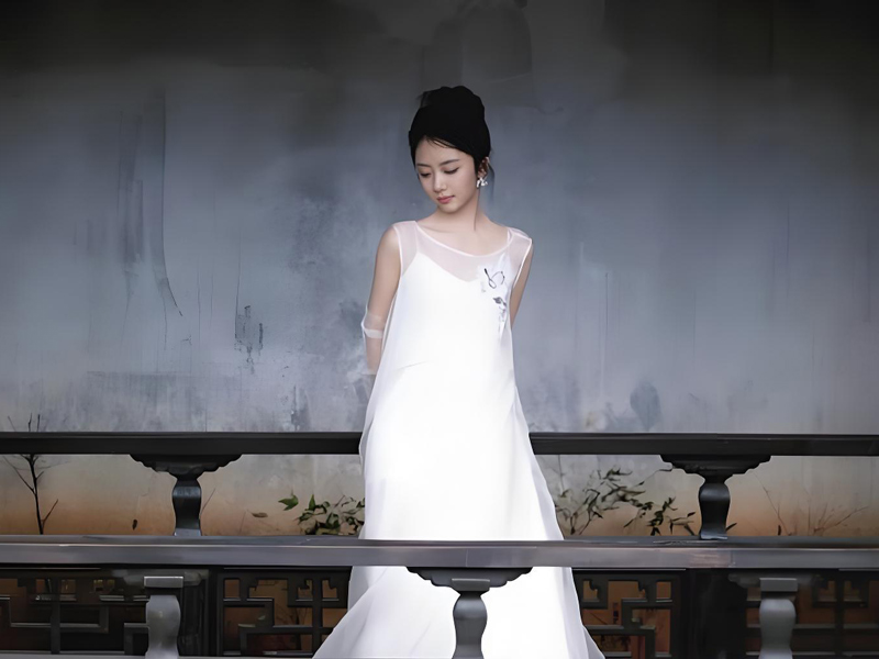 Tan Songyun: A White Silk Photoshoot at 35