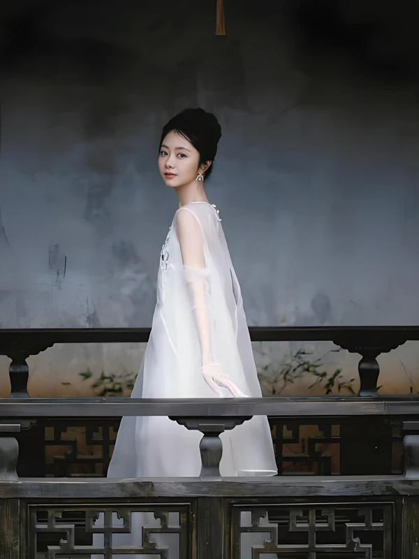 Tan Songyun: A White Silk Photoshoot at 35