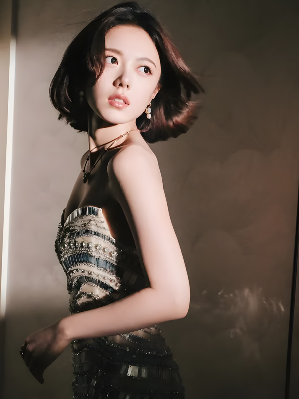 Zhao Jinmai Shines in Gold Scale Gown