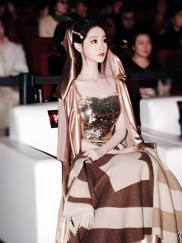 Zhu Xudan Shines in Golden Sequin Gown and Champagne Cape