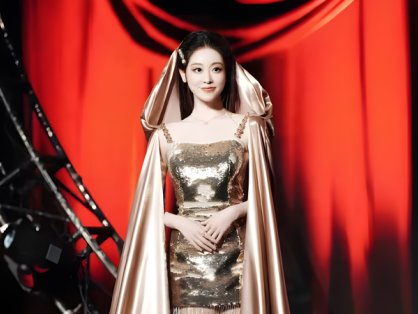 Zhu Xudan Shines in Golden Sequin Gown and Champagne Cape